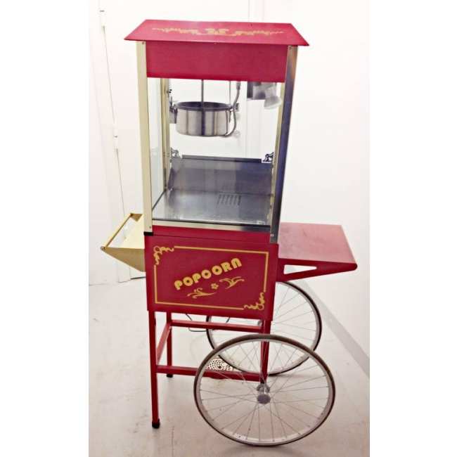 Stor röd popcornmaskin med klassisk vagn för upp till 8 ounce popcorn med varmhållningslampa, genomskinligt displayglas samt genomskinliga dörrar.